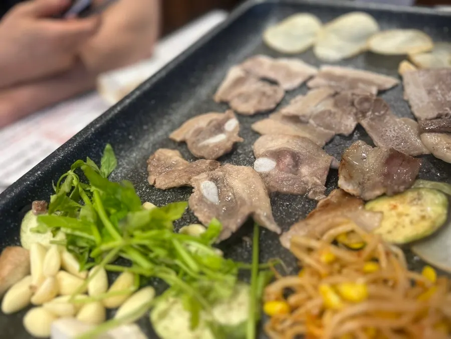 Daepae Sinhwa's salad bar filled with wrap vegetables