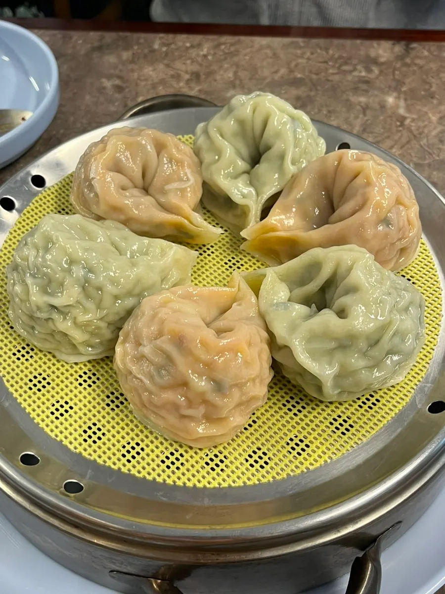 A plate of half meat and half kimchi dumplings