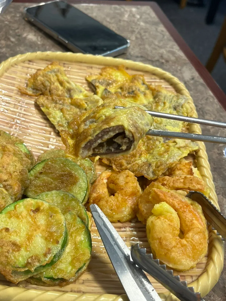 Mixed pancake platter with shrimp, zucchini, and beef pancakes