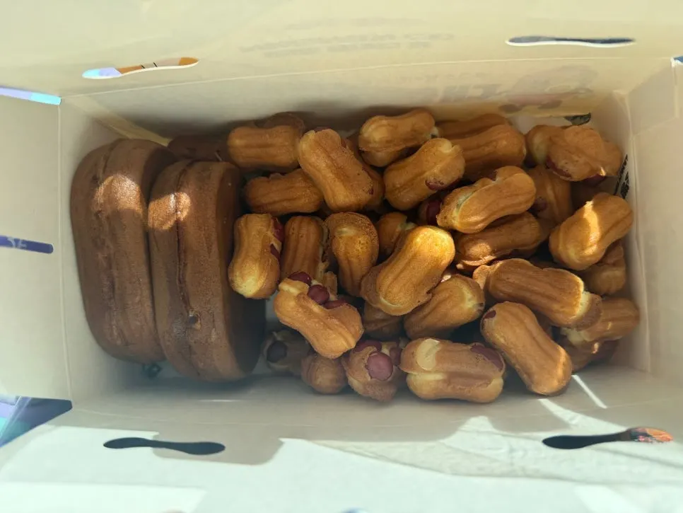 Packaging box filled with peanut bread and egg bread