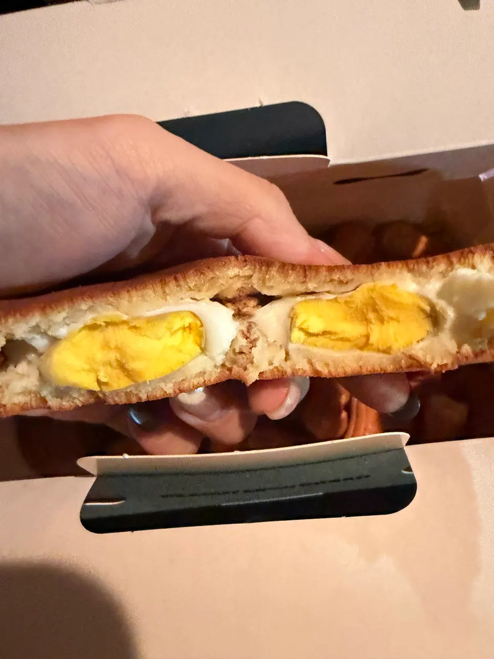 Cross-section of egg bread showing a whole egg