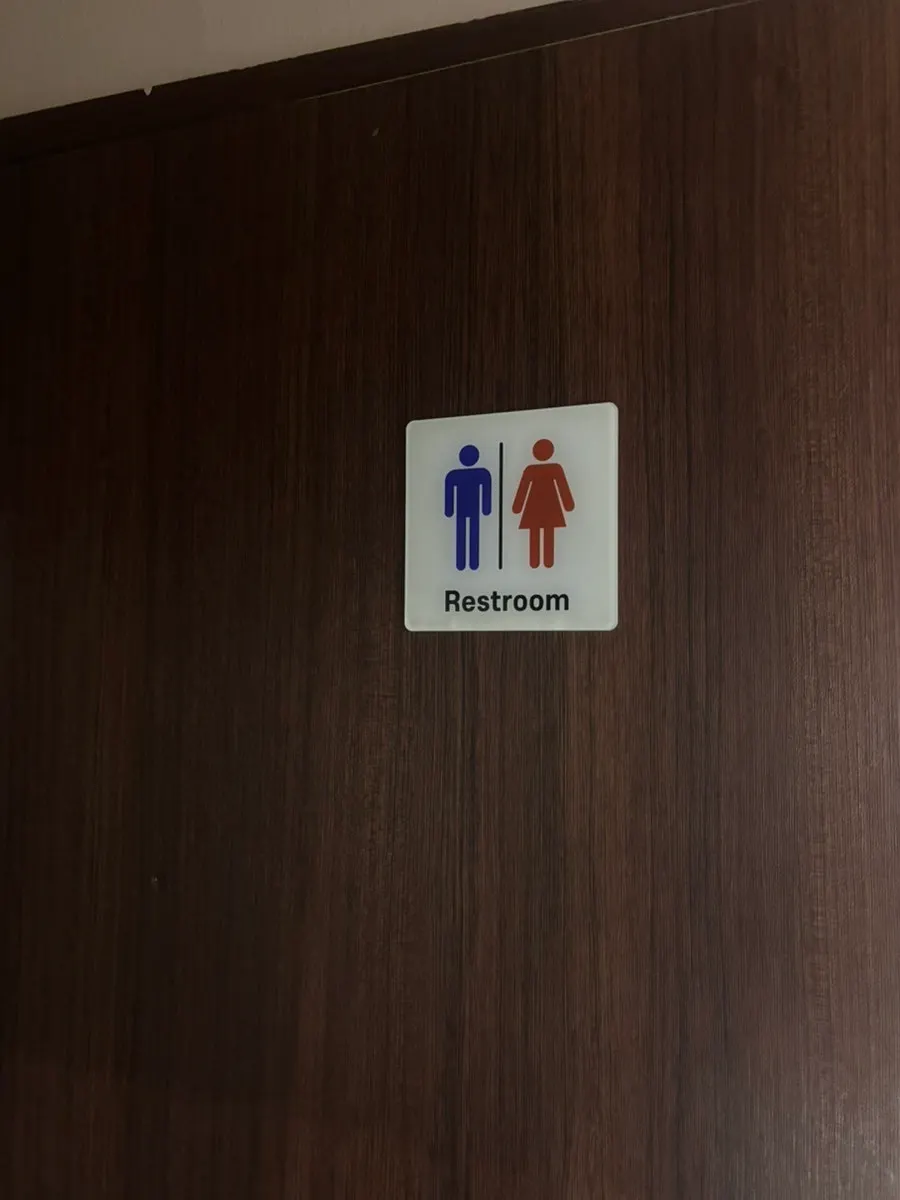 Clean restroom with separate facilities for men and women
