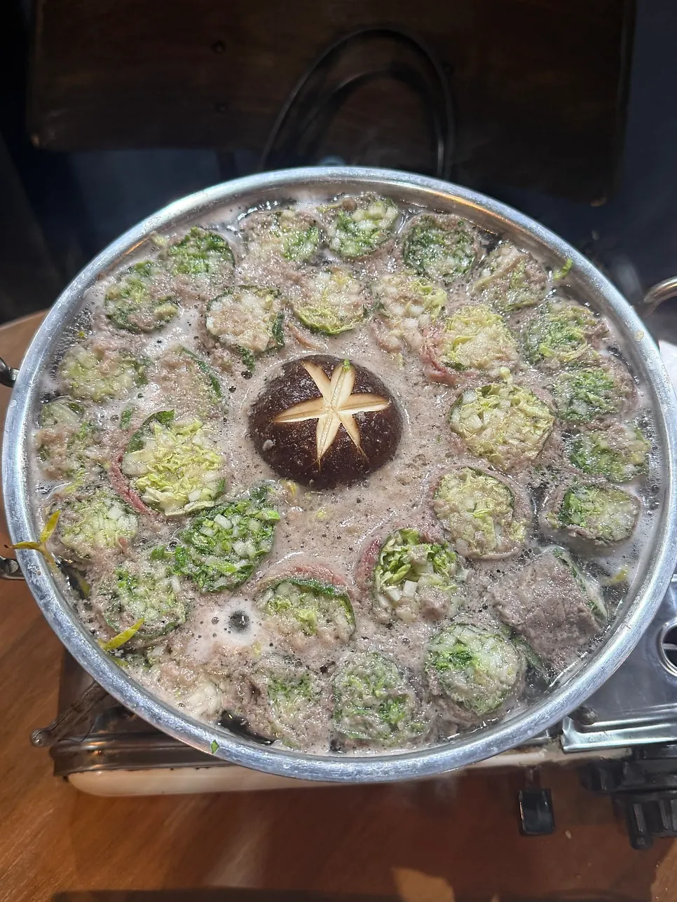 Beef and vegetables rolled and arranged in the flower hot pot