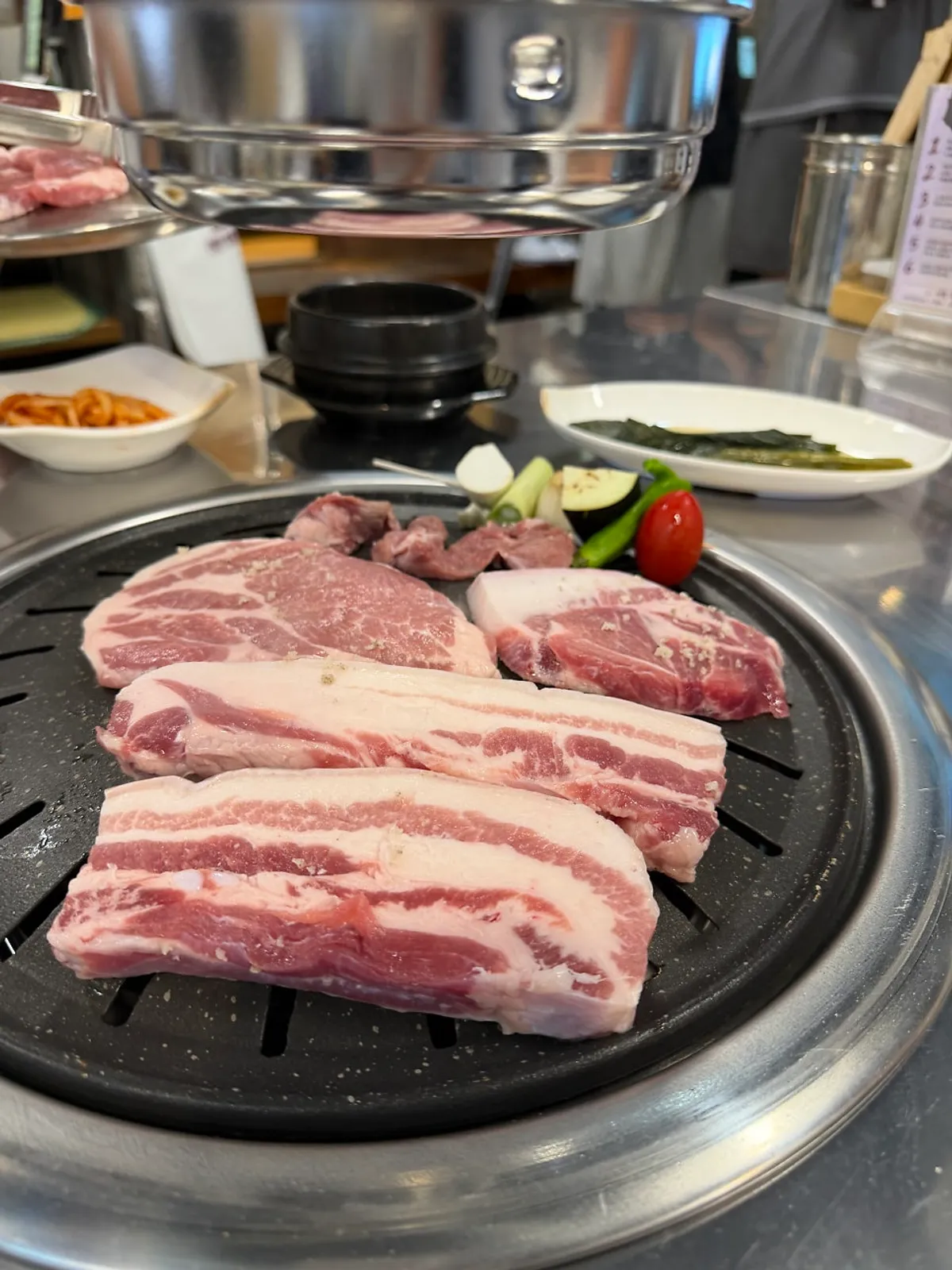 A plate of raw Jirye black pork combo 500g