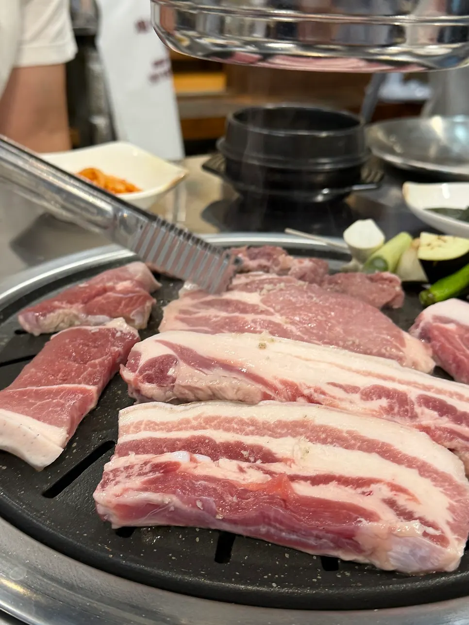 Jirye black pork combo placed on the charcoal grill
