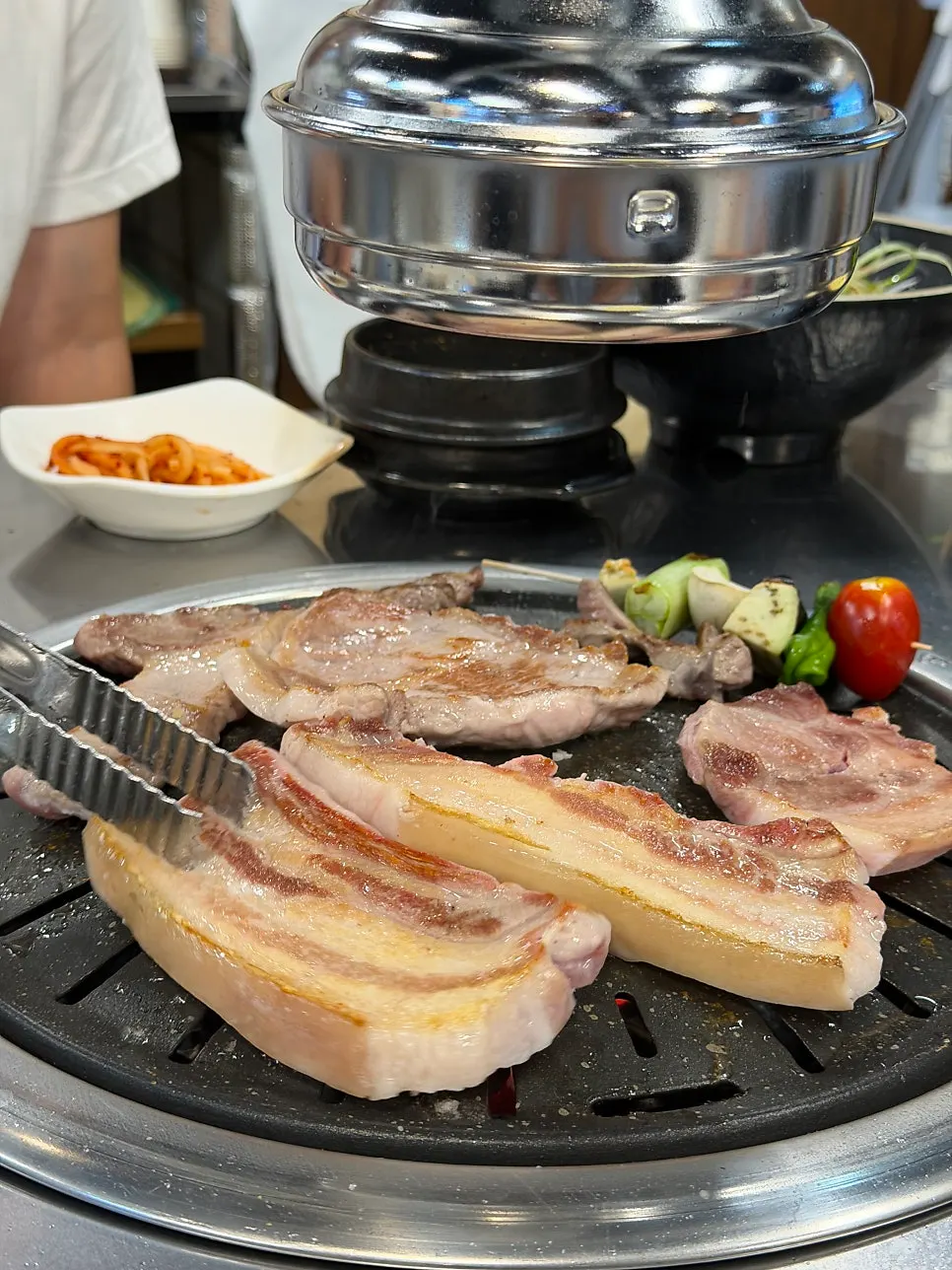 Black pork turning golden brown on the grill