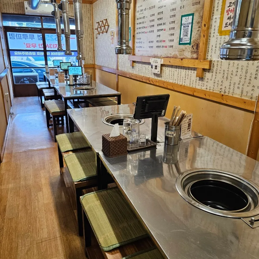 Table and charcoal grill at Daewol Charcoal Barbecue