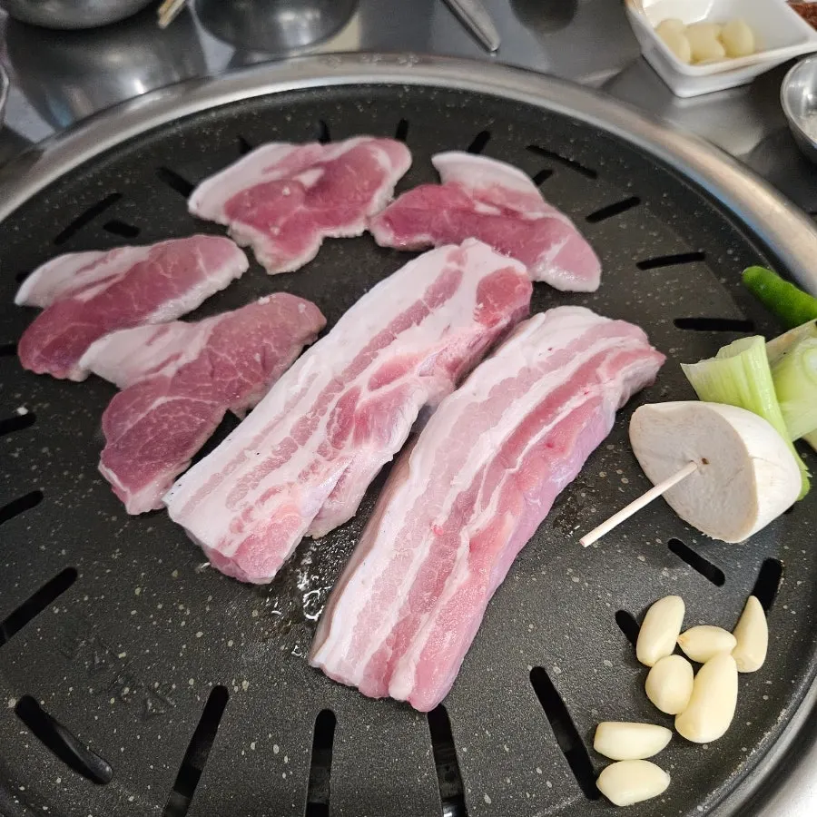 Black pork placed on the charcoal grill
