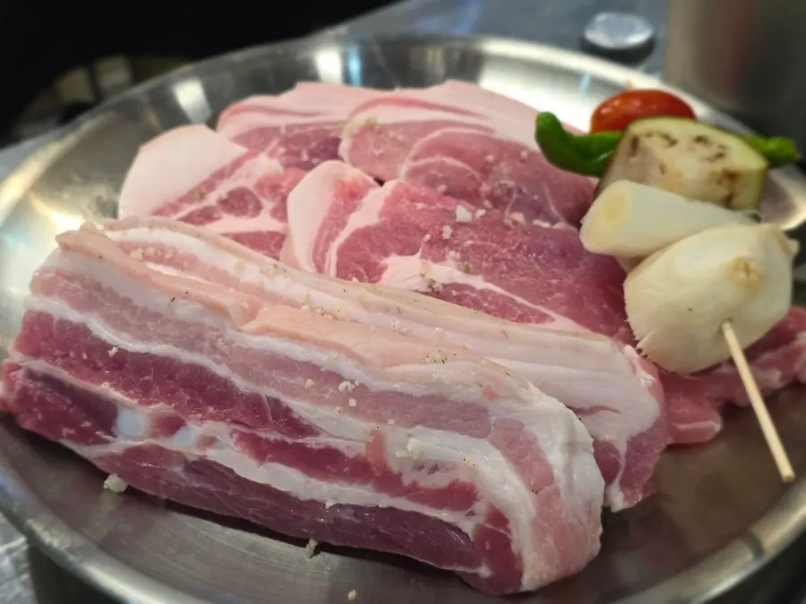 Basic table setting with cold boiled pork and silkworm pupa soup