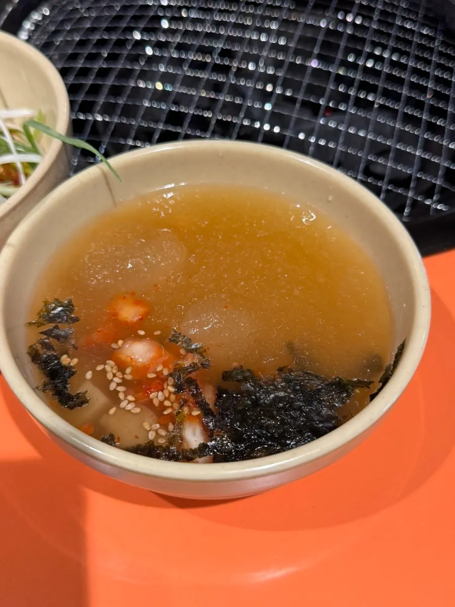 Cool dongchimi broth served as an appetizer