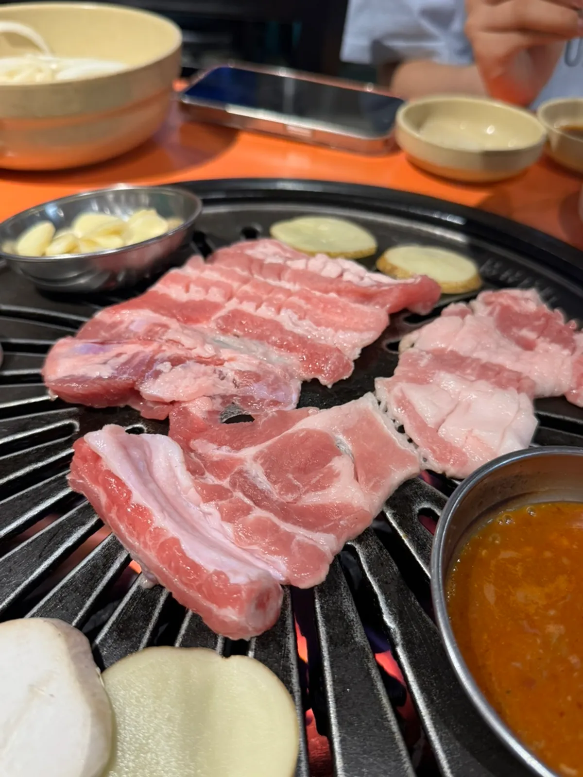 Raw ribs, one serving, on a heated cast-iron pan
