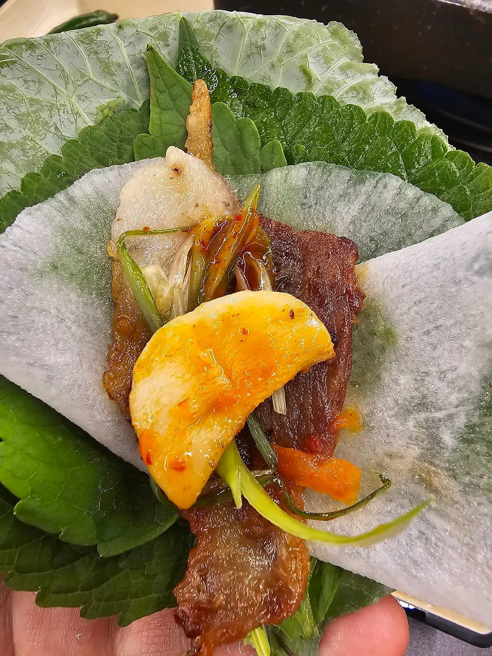 Thin-cut pork belly served with lettuce wraps