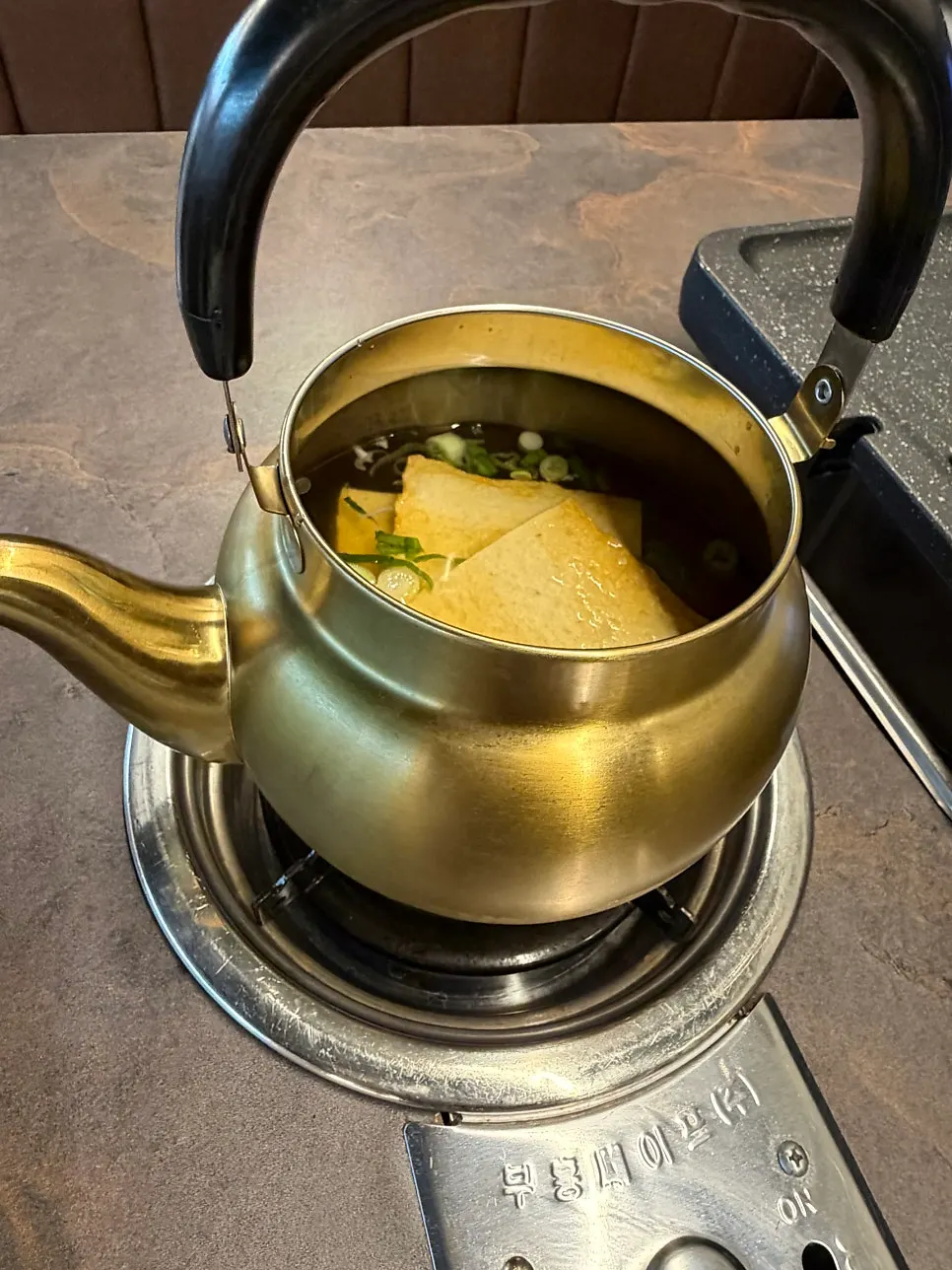 Fish cake soup broth simmering