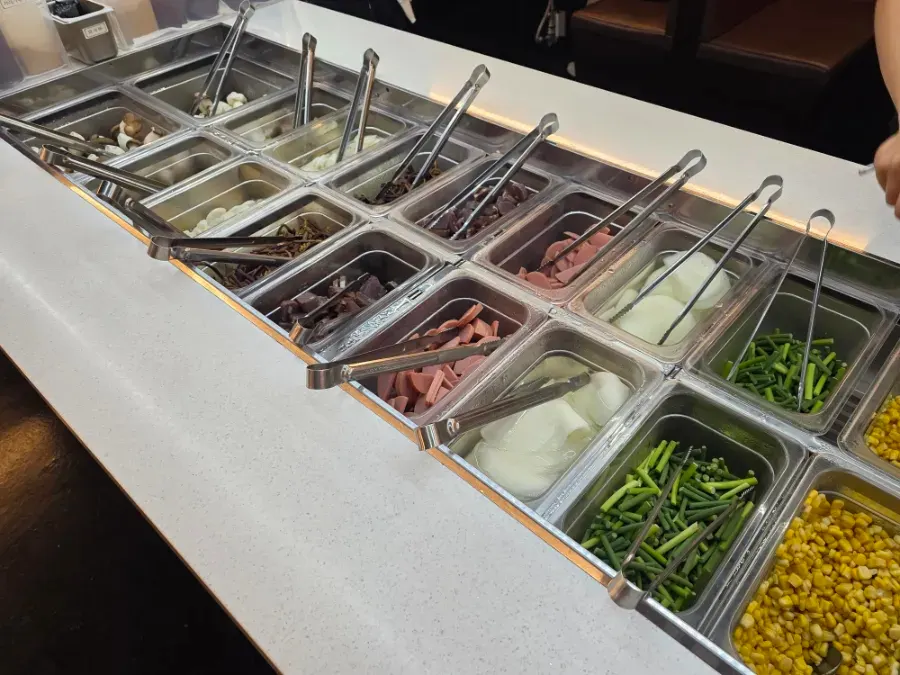 Self-serve bar display with grilling sides