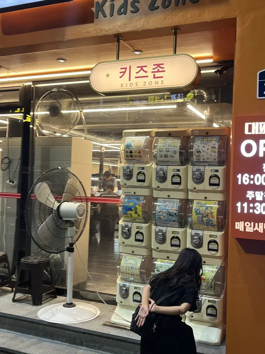 Kids' zone gacha machine at the entrance