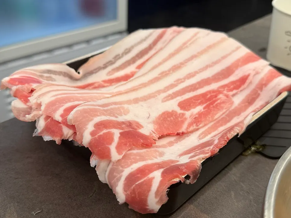Raw plate of ssol-o-gyeopsal pork belly