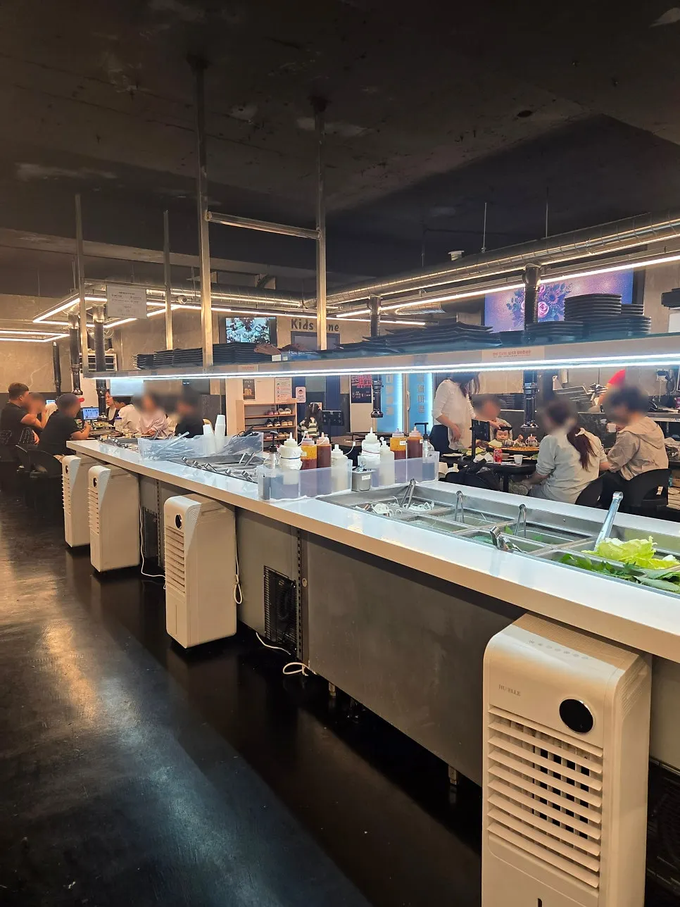 Self-serve bar full of vegetables and side dishes