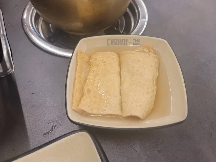 Welcome fish cake soup served at the table