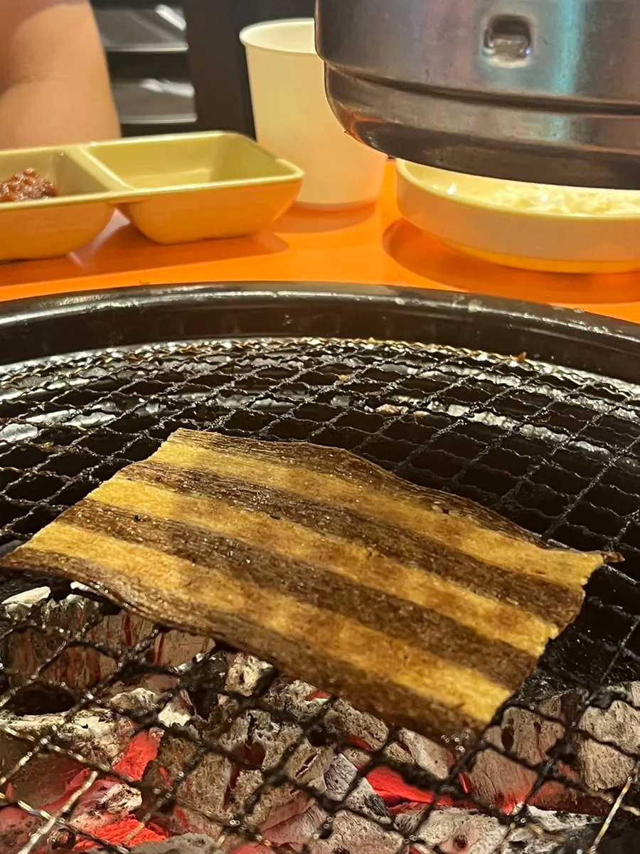 Jjondeugi cooked over the charcoal grill