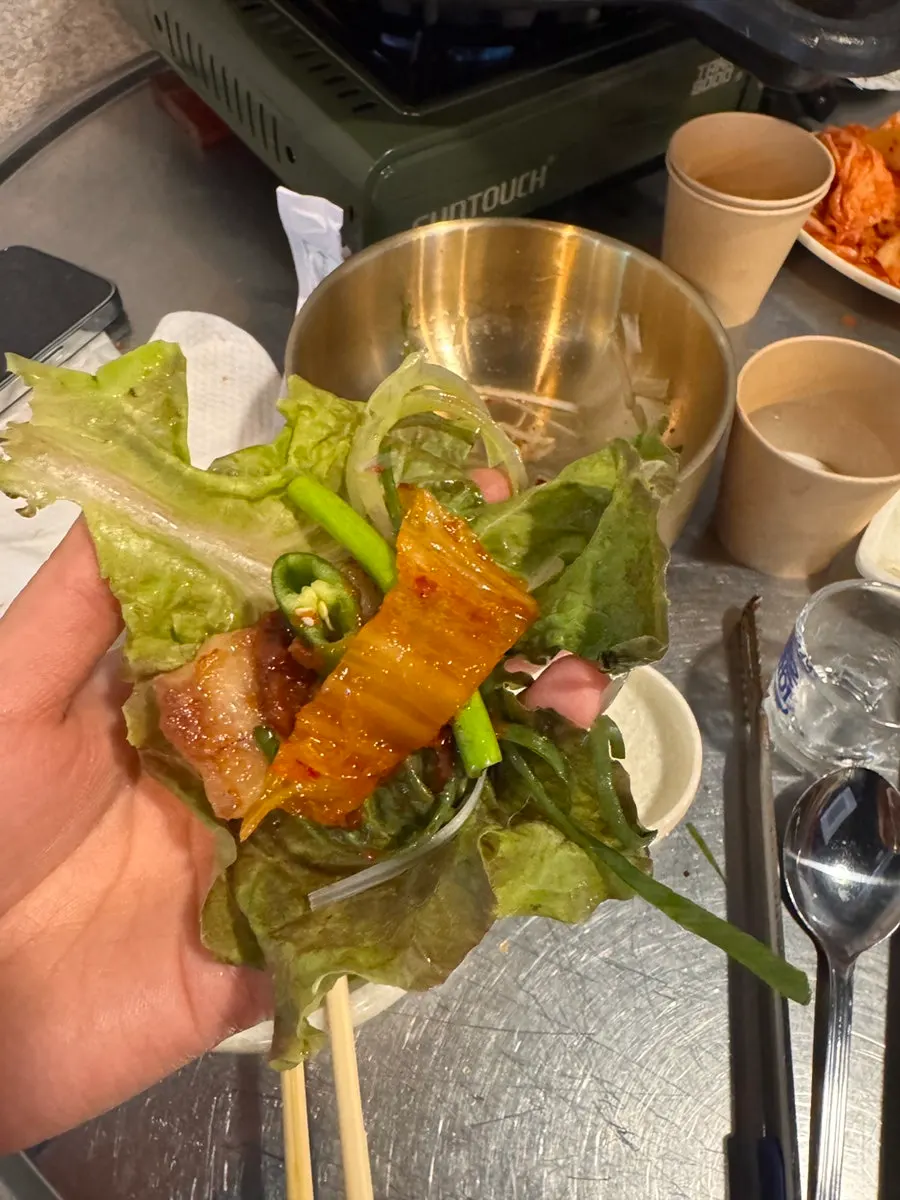 Grilled kimchi and pork belly on the tabletop grill