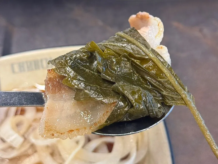 Daepae samgyeopsal and grilled sides on the pan