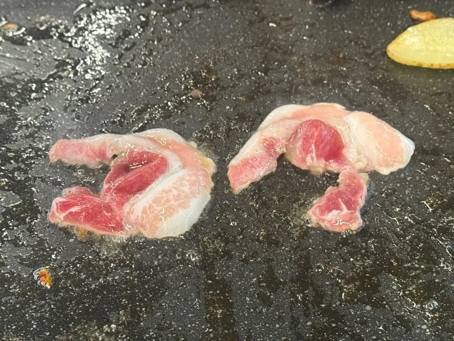 Daepae samgyeopsal wrap with lettuce and jeotgal
