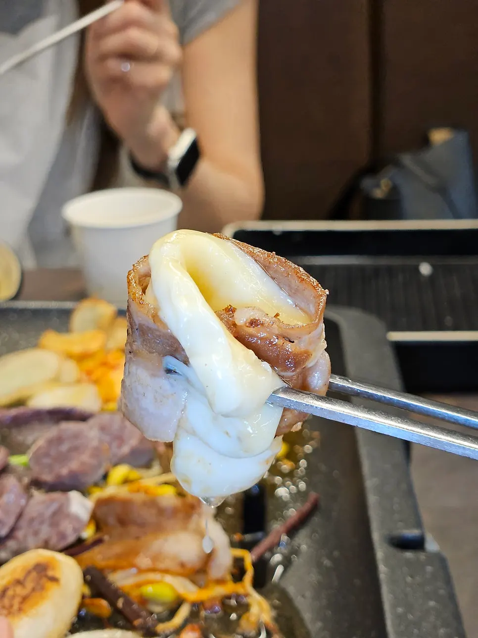 Cheese grilling on the barbecue plate