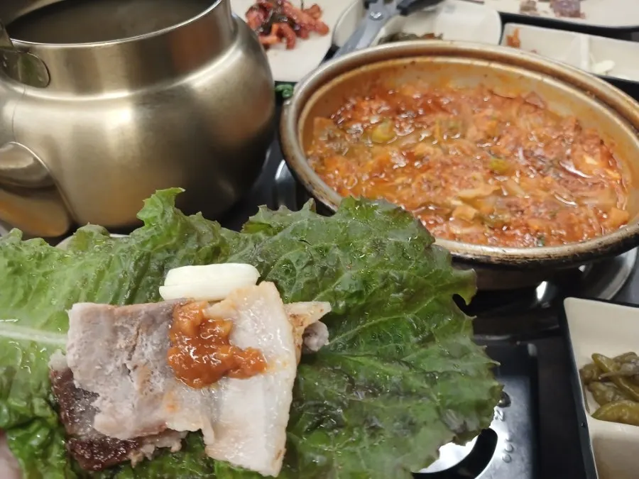Sliced pork belly enjoyed in a lettuce wrap