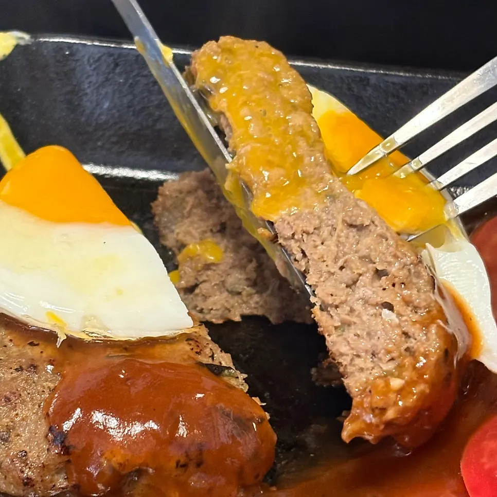 Hamburg steak with soft-boiled egg yolk spilling out