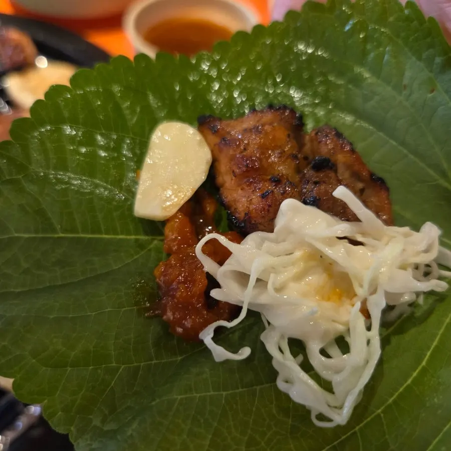 Charcoal-grilled ribs eaten with ssam wraps