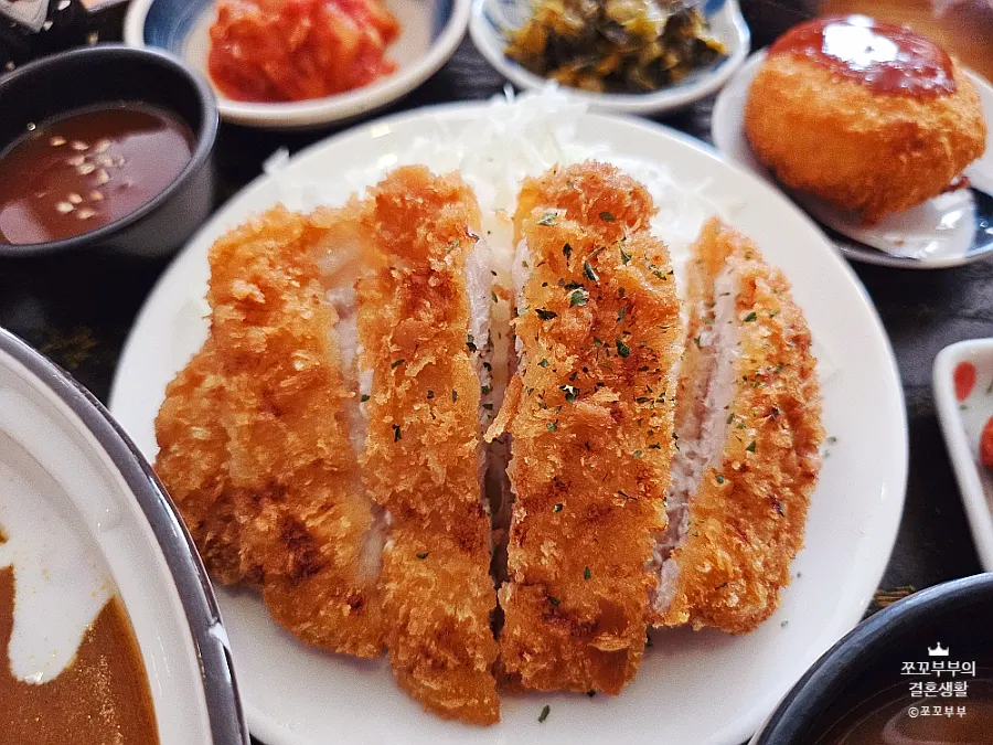 Table filled with fried dishes at Daidokoro