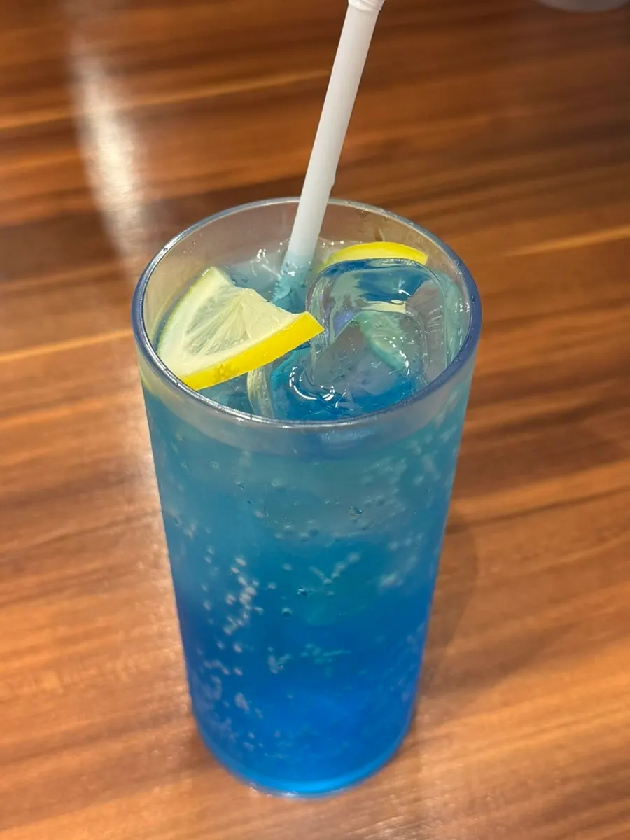 Vividly colored blue lemon ade