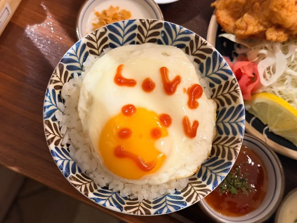 Fried egg with a message written in ketchup