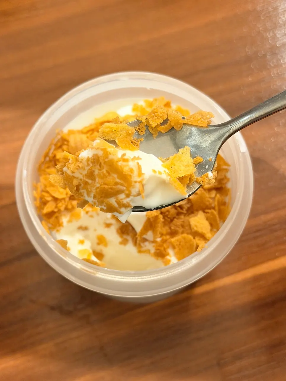 A spoonful of milk pudding with crunchy topping