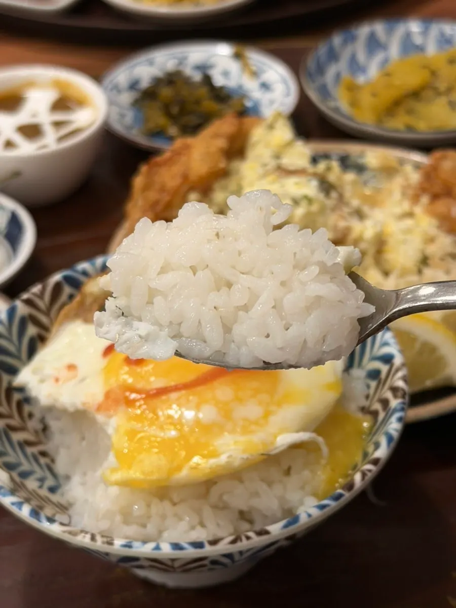 Rice and side dishes plated as part of a set meal
