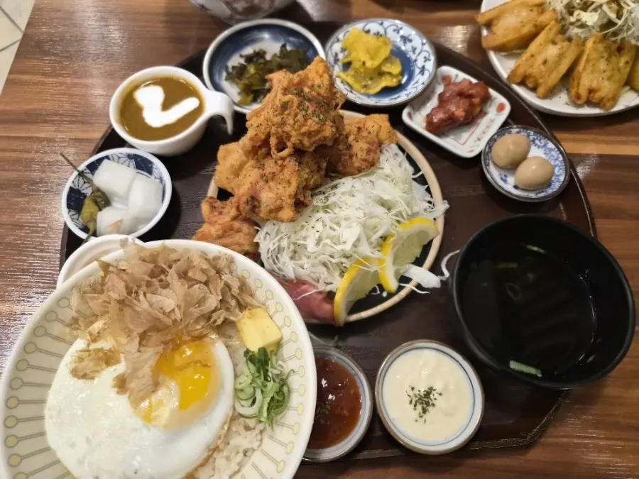 Table filled with two set meals, menbosha and udon