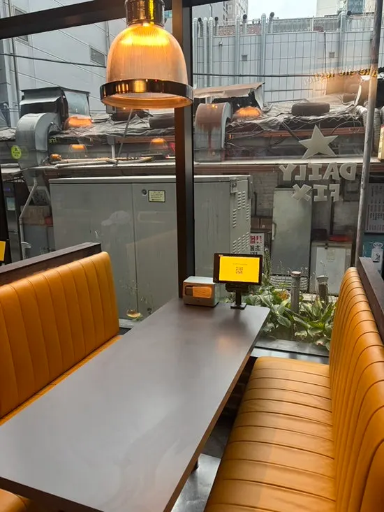 Interior with window sofa seating and tables