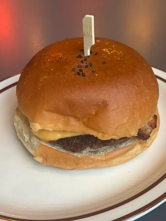 Cross-section of the bacon cheese burger showing the beef patty