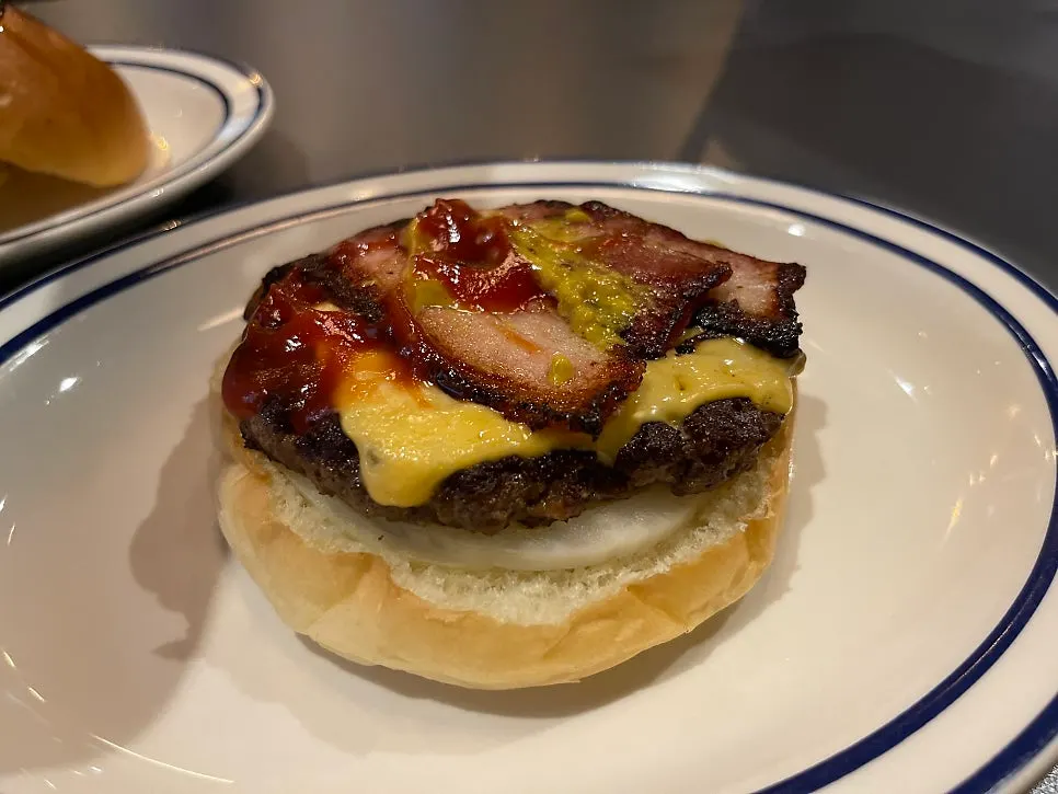 Side view of the simple-looking bacon cheese burger