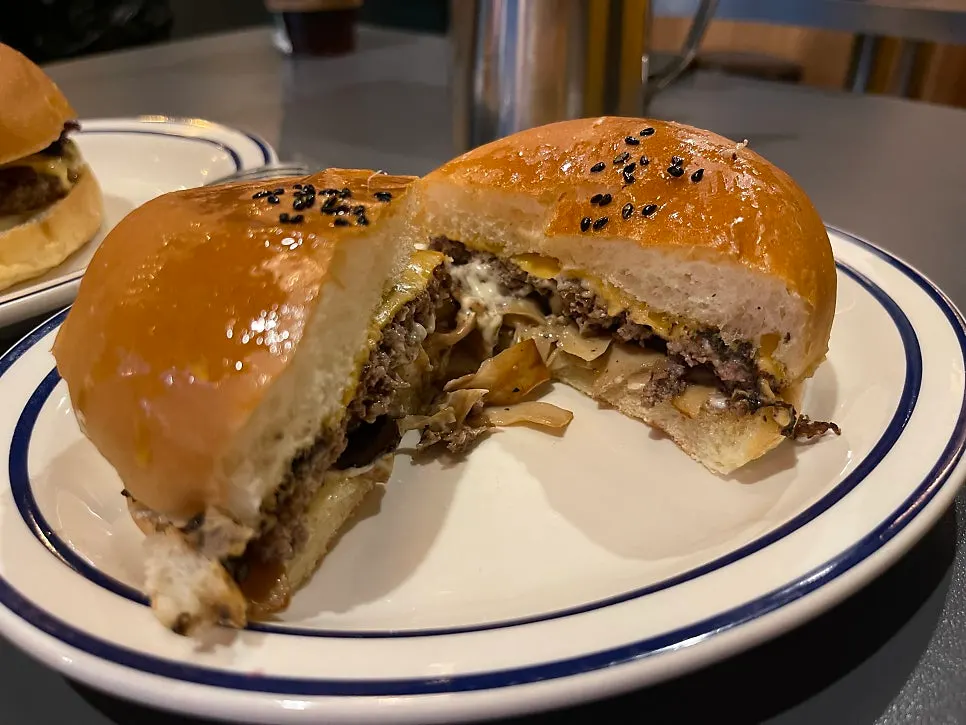 Cross-section of the truffle mushroom burger showing thin mushroom slices
