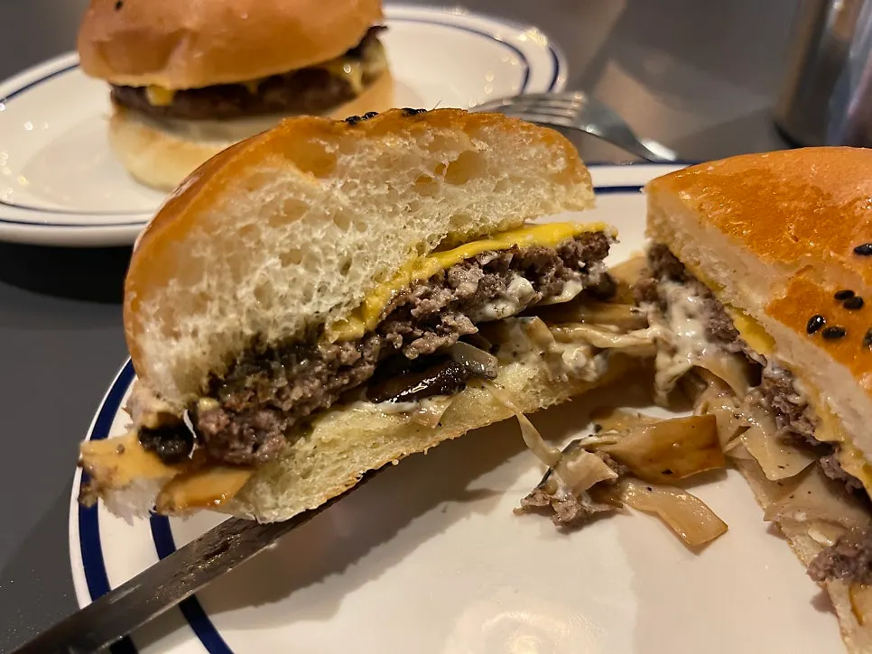 A bite taken out of the truffle mushroom burger
