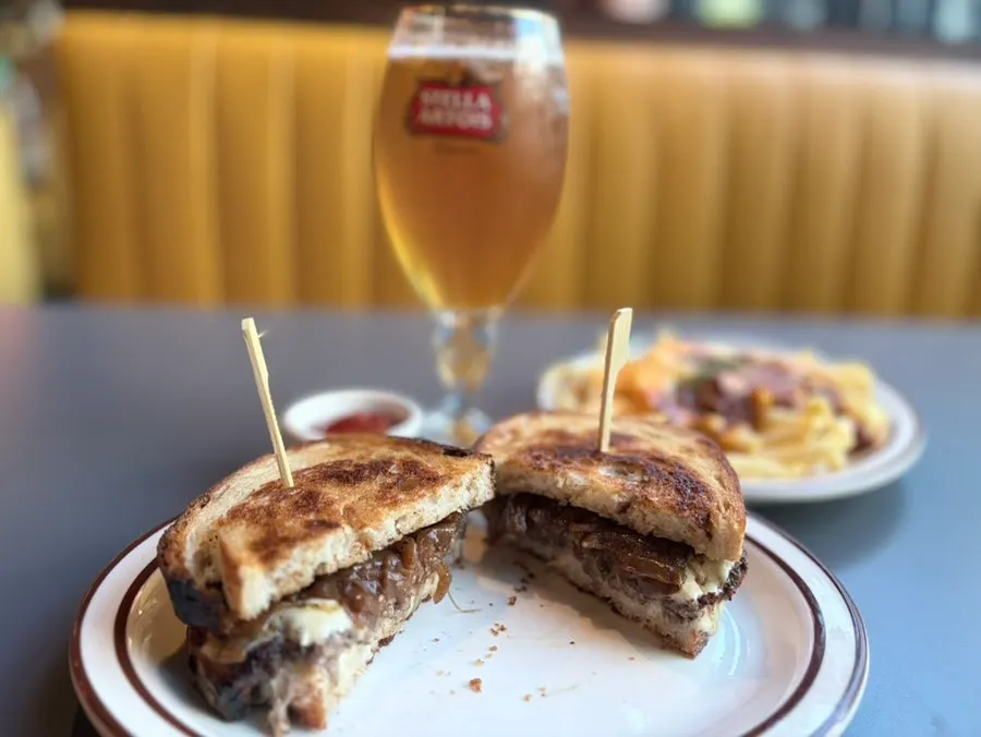 Chili cheese fries served alongside beer