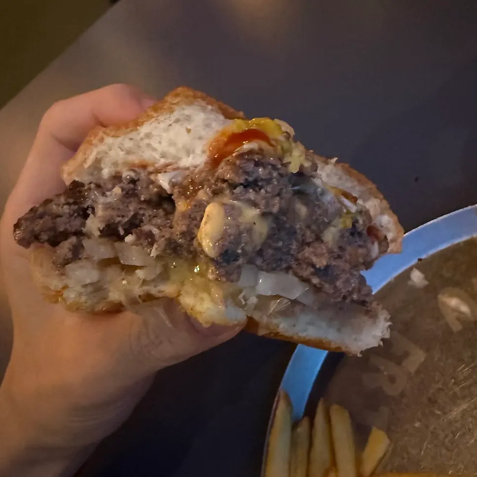 Cross-section of Double Cheese Burger with melted cheese