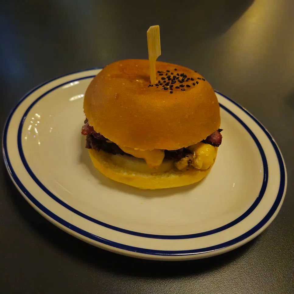 Bacon Cheeseburger topped with handmade bacon and cheese