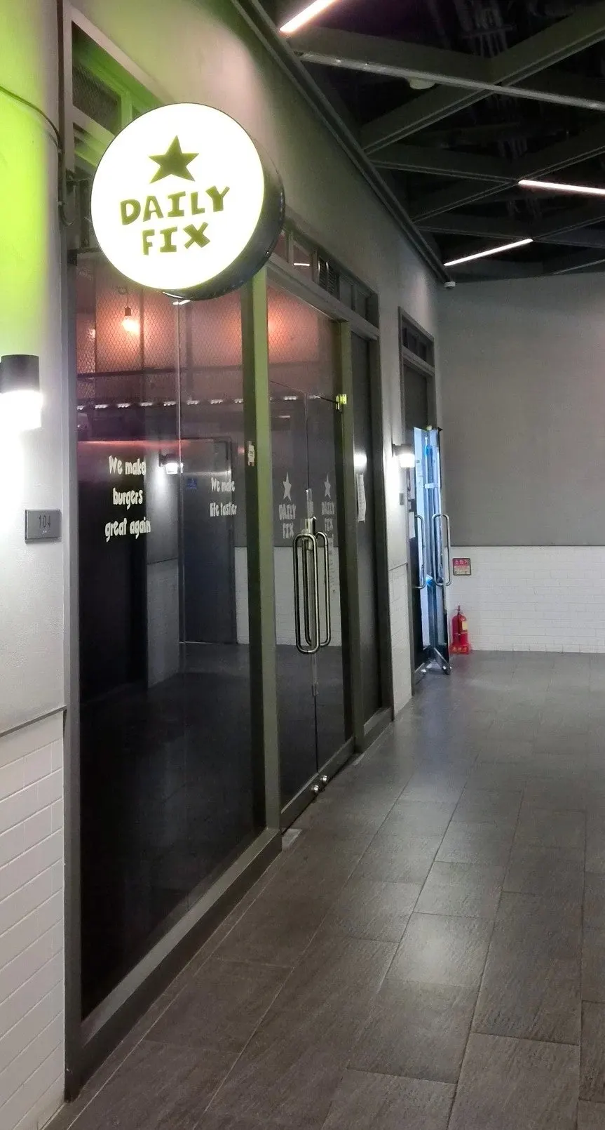 Storefront entrance showing the DAILY FIX sign