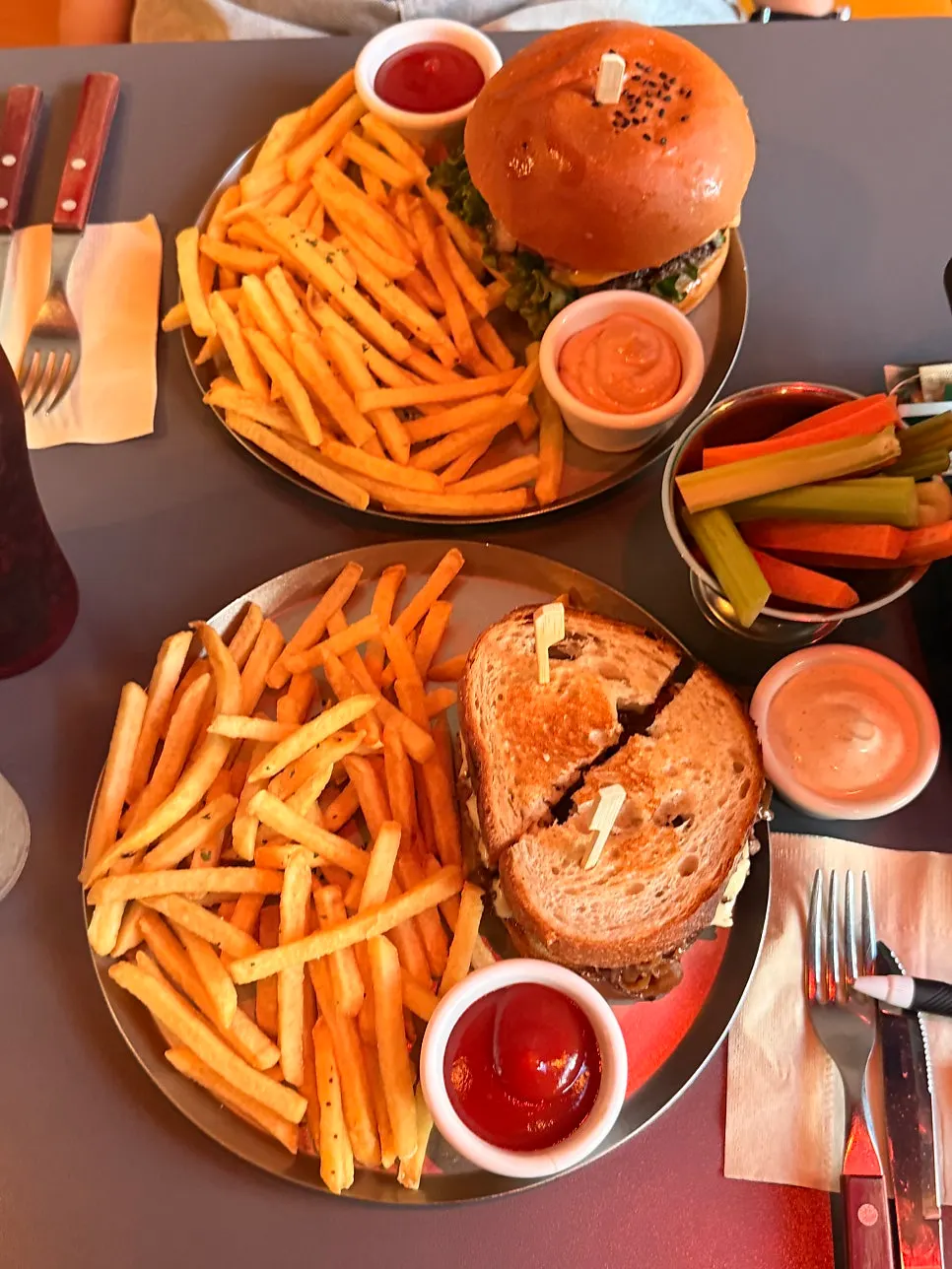 Table set with two burger sets and sides