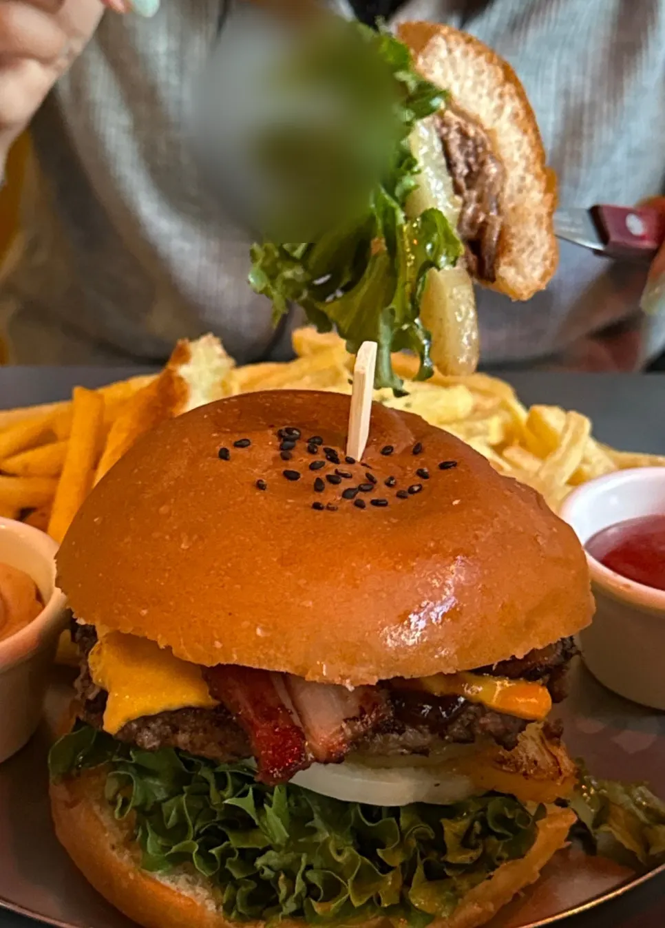 Cross-section of the Hawaiian burger with pineapple and bacon