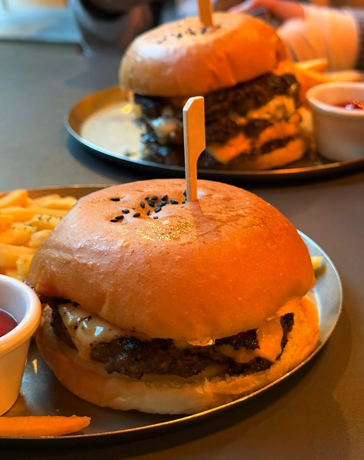 Daily Fix bacon cheese burger stacked with patty, cheese, and bacon