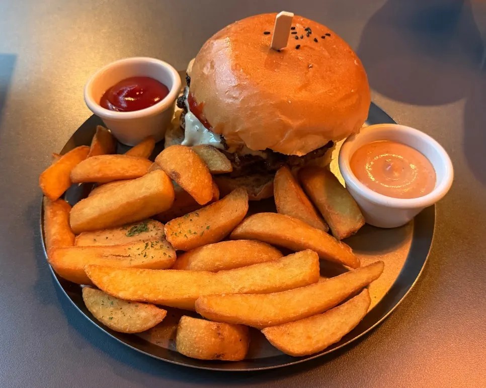 Cross-section of the bacon cheese burger after a bite