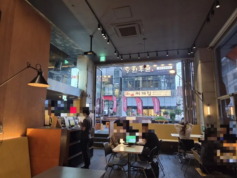 Interior of Daily Fix Gangnam Main Branch with wood tones and warm lighting